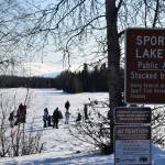 Kenai Peninsula Borough School District elementary students ice fish at Sport Lake in Soldotna as part of the Alaska Department of Fish and Games Salmon in the Classroom ice fishing educational program on Wednesday, March 2, 2022, in Soldotna, Alaska. (Camille Botello/Peninsula Clarion)