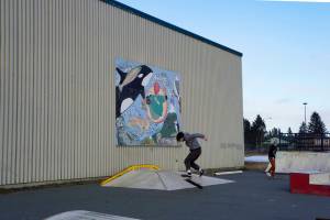 A group of young people try out the thawed skate park on Monday, Feb. 28, 2022, at the Homer Education and Recreation Complex in Homer, Alaska. The Homer City Council met Monday and heard a report by Stantec staff on a proposed design for a new community center to go on the HERC site. The design includes a skate park. (Photo by Michael Armstrong/Homer News)