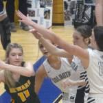 Seward's Lena Jagielski passes under pressure from Jolie Widaman, Katelyn Morrison and Adarra Hagelund on Thursday, March 3, 2022, at Soldotna High School in Soldotna, Alaska. (Photo by Jeff Helminiak/Peninsula Clarion)