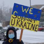Michele Vasquez demonstrates during the Many Voices Ukraine vigil on Saturday, March 5, 2022, in Soldotna, Alaska. (Camille Botello/Peninsula Clarion)