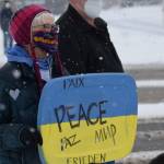 Susie Smalley demonstrates during the Many Voices Ukraine vigil on Saturday, March 5, 2022, in Soldotna, Alaska. (Camille Botello/Peninsula Clarion)