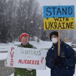 Peggy Mullen and Brent Johnson demonstrate during the Many Voices Ukraine vigil on Saturday, March 5, 2022, in Soldotna, Alaska. (Camille Botello/Peninsula Clarion)