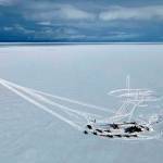 In this aerial photo provided by Alaska State Troopers, an Alaska Air National Guard helicopter arrives at a frozen lake that was the scene of a small plane crash on Saturday, March 5, 2022, near Iliamna, Alaska. Authorities say the five people on board the plane were injured. (Trooper Travis Lons/Alaska State Troopers via AP)