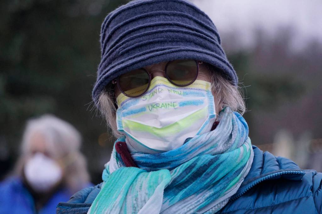 Susan Cushing wears a facemask saying Stand With Ukraine at a demonstration in support of Ukraine on Thursday, March 3, 2022, at WKFL Park in Homer, Alaska. (Photo by Michael Armstrong/Homer News)
