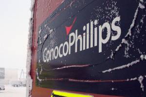 This Feb. 9, 2016, file photo shows an ice-covered ConocoPhillips sign at a drilling site in Nuiqsut, Alaska. Authorities are investigating a natural gas leak detected last week at a ConocoPhillips Alaska oil drill site on Alaskas North Slope, officials said. Grace Salazar, a special assistant with the Alaska Oil and Gas Conservation Commission, said Wednesday, March 9, 2022, that the commission that oversees oil and gas drilling in the state is investigating the matter. (AP Photo/Mark Thiessen, File)