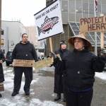 Nancy Keen (right), Vivian Mork, Marvin Willard and Rosita Worl (left) protest outside the Dimond Courthouse as a court hearing between the Sitka Tribe of Alaska and the Department of Fish and Game on herring limits in Sitka Sound takes place inside on Tuesday, Feb. 18, 2019. (Michael Penn / Juneau Empire File)