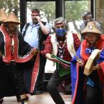 Dancers concluded a ceremony re-installing a totem pole in the atrium of the State Office Building on Friday, March 11, 2022.