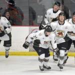 The Kenai River Brown Bears celebrate a goal by Carter Cloutier (21) against the Fairbanks Ice Dogs on Friday, March 11, 2022, at the Soldotna Regional Sports Complex in Soldotna, Alaska. (Photo by Jeff Helminiak/Peninsula Clarion)