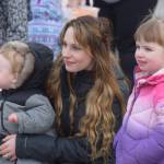Kids line the streets in Soldotna during the Sweeneys St. Patricks Parade on March 17, 2022. (Camille Botello/Peninsula Clarion)
