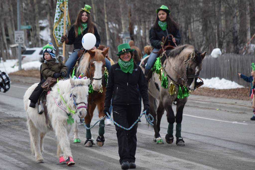 Community members participate in the St. Patrick's Parade in Soldotna on March 17, 2022. (Camille Botello/Peninsula Clarion)