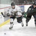 Kenai River Brown Bears forward Kris Zapata and Minnesota Wilderness forward Cole Gordon battle for the puck Friday, March 18, 2022, at the Soldotna Regional Sports Complex in Soldotna, Alaska. (Photo by Jeff Helminiak/Peninsula Clarion)