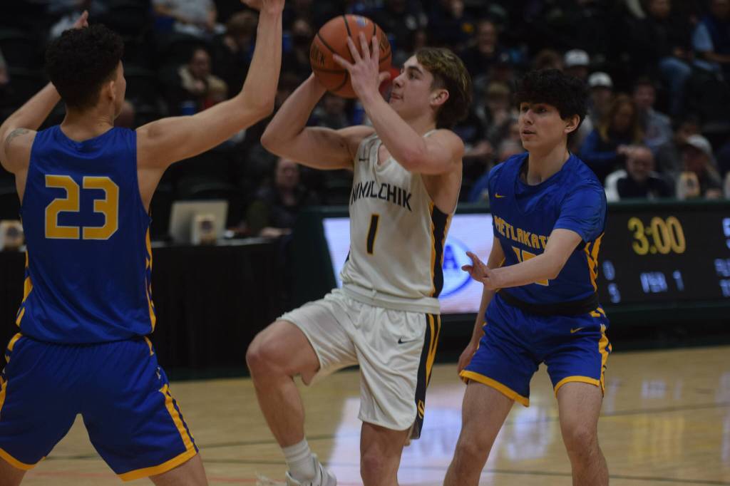 Landon Colburn takes a shot against Metlakatla's Shayne Anderson during the 2A state basketball championship game at the Alaska Airlines Center in Anchorage, Alaska on Saturday, March 19, 2022. (Camille Botello/Peninsula Clarion)