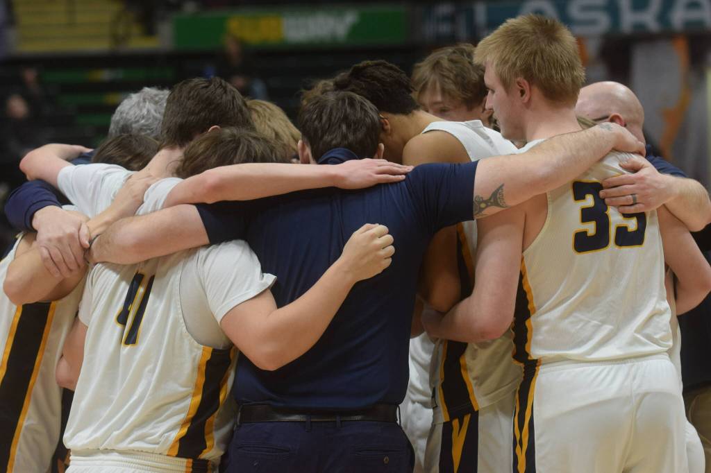 The Ninilchik Wolverines win the Class 2A state basketball championship game at the Alaska Airlines Center in Anchorage, Alaska, on Saturday, March 19, 2022. (Camille Botello/Peninsula Clarion)
