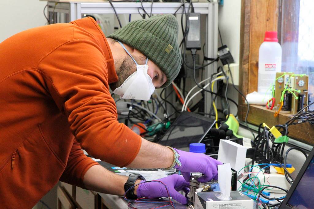 This Feb. 17, 2022, photo shows Roman Pohorsky, a doctorate student at the EPFL, a science and technology institution in Switzerland, working with lab equipment in Fairbanks, Alaska. Over seven weeks this winter, nearly 50 scientists from the continental U.S. and Europe descended on Fairbanks to study the sources of air pollution, how they interact in the citys cold and dark climate and to come up with a list of best practices for others across the circumpolar north struggling to get a breath of fresh air. (AP Photo/Mark Thiessen)