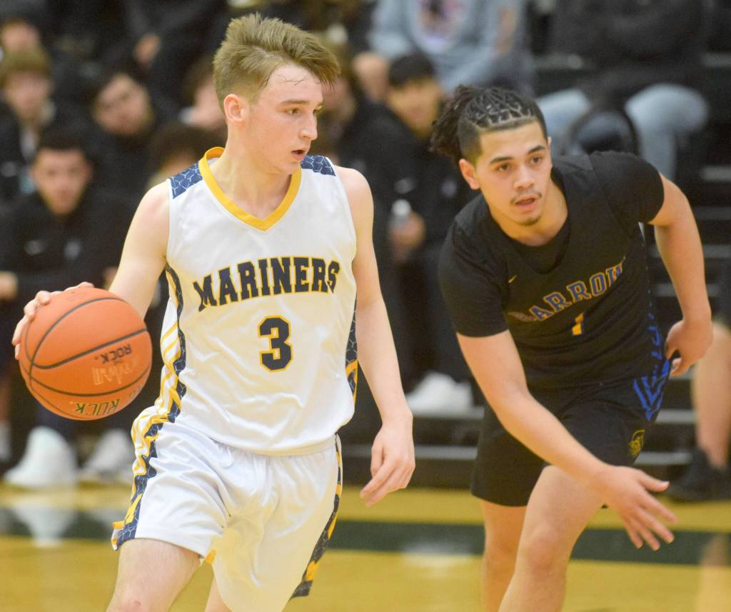 Homers Peyton Edens makes a move toward the basket during the Class 3A boys basketball fourth-place semifinals at the Alaska Airlines Center in Anchorage, Alaska, on Thursday, March 24, 2022. (Camille Botello/Peninsula Clarion)