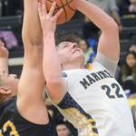 Homer's Carter Tennison takes a shot against Barrow's Uata Tuifua during the Class 3A boys basketball fourth-place semifinals at the Alaska Airlines Center in Anchorage, Alaska, on Thursday, March 24, 2022. (Camille Botello/Peninsula Clarion)