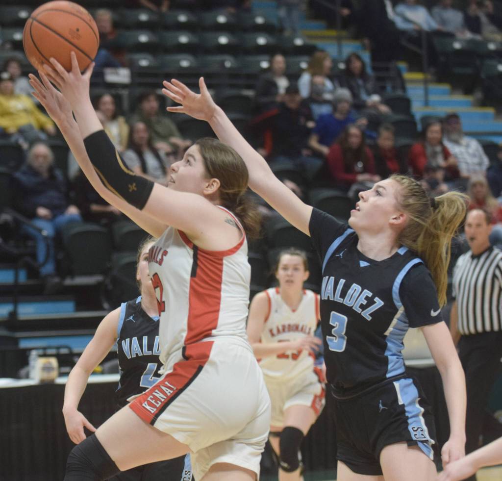 Kenai Central's Denali Bernard takes a shot against Valdez's Carsyn Hinkle during the Class 3A girls basketball fourth-place semifinals at the Alaska Airlines Center in Anchorage, Alaska, on Thursday, March 24, 2022. (Camille Botello/Peninsula Clarion)