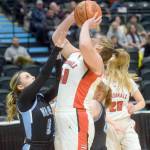 Kenai Central's Emma Beck takes a shot against Valdez's Luci Selanoff during the Class 3A girls basketball fourth-place semifinals at the Alaska Airlines Center in Anchorage, Alaska, on Thursday, March 24, 2022. (Camille Botello/Peninsula Clarion)