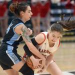 Kenai Central's Malerie Nunn fights for the ball against Valdez defender Kylie Gilbert during the Class 3A girls basketball fourth-place semifinals at the Alaska Airlines Center in Anchorage, Alaska, on Thursday, March 24, 2022. (Camille Botello/Peninsula Clarion)