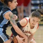 Kenai Central's Malerie Nunn fights for the ball against Valdez defender Kylie Gilbert during the Class 3A girls basketball fourth-place semifinals at the Alaska Airlines Center in Anchorage, Alaska, on Thursday, March 24, 2022. (Camille Botello/Peninsula Clarion)