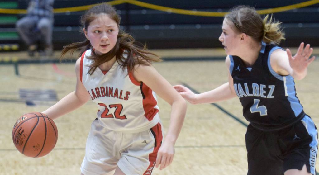 Kenai Central's Emilee Wilson drives past Valdez's Ambrosia Woodgate during the Class 3A girls basketball fourth-place semifinals at the Alaska Airlines Center in Anchorage, Alaska, on Thursday, March 24, 2022. (Camille Botello/Peninsula Clarion)