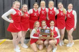 The Kenai Central cheerleading team poses with their trophy for winning the Division II March Madness state competition at the Alaska Airlines Center in Anchorage, Alaska, on Tuesday, March 22, 2022. In the back row are Kaitlyn Taylor, Delaney Duck, Genesis Trevino, Calani Holmes, Malena Grieme, Maya Montague and Karah Huff. In the front row are Brooklynn Reed, Ella Romero and Annemarie Pienta. (Photo provided by team)
