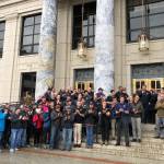 State and municipal public safety employees gathered on the steps of the Alaska State Captiol on Thursday, March 31, 2022, to urge senators to act on a bill to rework the states pension system for police, fire fighters and other public safety employees. (Peter Segall / Juneau Empire)