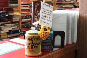 Ashlyn OHara/Peninsula Clarion 
A teapot holds crocheted sunflowers at Already Read bookstore on Thursday in Kenai.