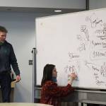 Bruce Vadla, left, and Kaitlin Vadla brainstorm during a community solutions meeting held by Cook Inletkeeper on Thursday, March 31, 2022, in Soldotna, Alaska. (Ashlyn OHara/Peninsula Clarion)