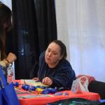 Community members participate in the Kenai Peninsula Job and Career Fair at the Soldotna Regional Sports Complex on Thursday, April 7, 2022, in Soldotna, Alaska. (Camille Botello/Peninsula Clarion)