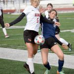 Kenai Centrals Chloe Goldsby and Soldotnas Zayra Poage battle for the ball Friday, April 8, 2022, at Kenai Central High School in Kenai, Alaska. (Photo by Jeff Helminiak/Peninsula Clarion)