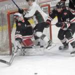 Kenai River Brown Bears forward Nick Stevens runs into Minnesota Magicians goalie Josh Langford on Saturday, April 9, 2022, at the Soldotna Regional Sports Complex in Soldotna, Alaska. (Photo by Jeff Helminiak/Peninsula Clarion)