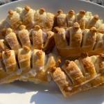 Buttery bear claws are filled with almond paste and topped with sugar glaze. (Photo by Tressa Dale/Peninsula Clarion)