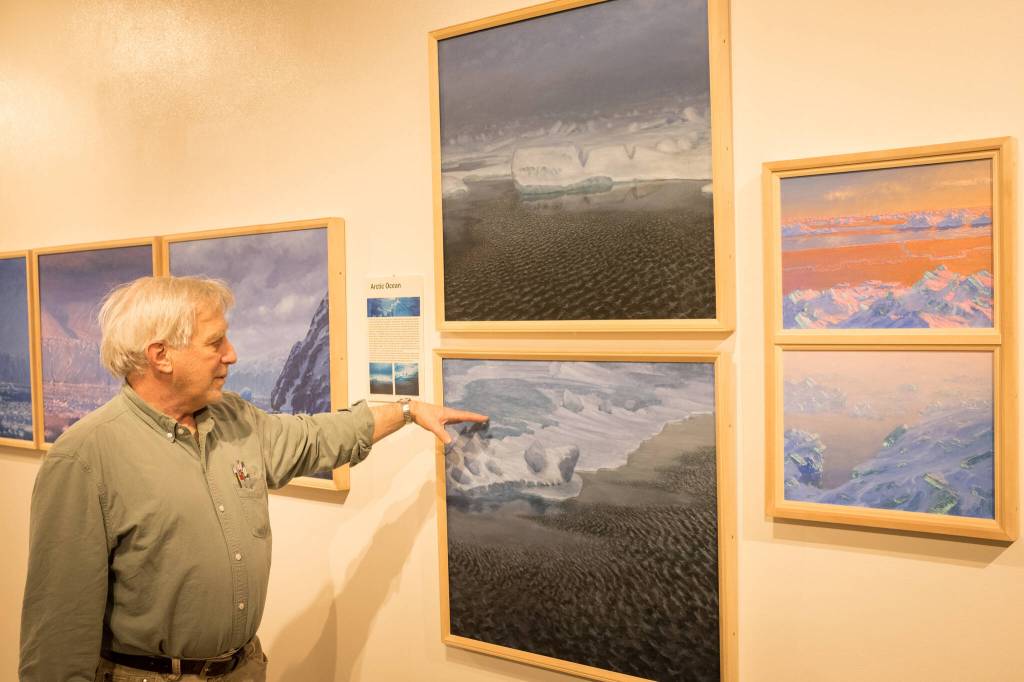David Rosenthal describes work from his travels around the Arctic Ocean and through the Northwest Passage from his show, Painting at the Edge of the Ice Age, at the Pratt Museum & Park in Homer, Alaska. (Photo by Sean McDermott)
