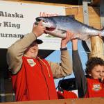 Weston Marley, left, holds up the 27.38-pound winter king salmon he caught to win the 28th annual Homer Winter King Salmon Tournament on Sunday, April 10, 2022, in Kachemak Bay, Homer, Alaska. At right is last years champion and Westons brother, Andrew Marley, 11  the youngest angler ever to win the tournament. Weston Marley, 15, fished on the Fly Dough with his father, Jay Marley. (Photo by Michael Armstrong/Homer News)