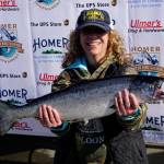 Mary Jo Porter holds the 9.24-pound winter king salmon she caught in the 28th annual Homer Winter King Salmon Tournament on Sunday, April 10, 2022, in Kachemak Bay, Homer, Alaska. (Photo by Michael Armstrong/Homer News)