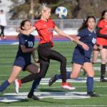 Kenai Centrals Cali Holmes tries to clear the ball from Soldotnas Caleigh Glassmaker and Caylee Uribe-Koivisto on Thursday, April 14, 2022, at Soldotna High School in Soldotna, Alaska. (Photo by Jeff Helminiak/Peninsula Clarion)