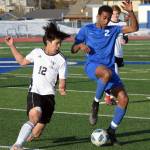 Soldotnas Maleda Denbrock tries to turn on Kenai Centrals Enrique Mercado on Thursday, April 14, 2022, at Soldotna High School in Soldotna, Alaska. (Photo by Jeff Helminiak/Peninsula Clarion)