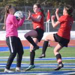 Soldotna goalie Sunny Miller makes a save in front of Kenai Centrals Tait Cooper and Kori Moore on Thursday, April 14, 2022, at Soldotna High School in Soldotna, Alaska. (Photo by Jeff Helminiak/Peninsula Clarion)