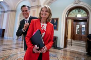 Republican Sens. Lisa Murkowski, of Alaska, and Mitt Romney of Utah, left, who say they will vote to confirm Judge Ketanji Brown Jacksons historic nomination to the Supreme Court, smile as they greet each other outside the chamber, at the Capitol in Washington, Tuesday, April 5, 2022. Murkowski continues to have a substantial cash advantage over her opponent backed by former President Donald Trump, who has vowed revenge on the incumbent Alaska Republican. Murkowski brought in more than $1.5 million in the three-month period ending March 31, 2022, according to Federal Election Commission filings. (AP Photo/J. Scott Applewhite, File)