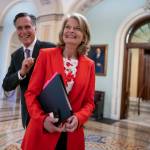 Republican Sens. Lisa Murkowski, of Alaska, and Mitt Romney of Utah, left, who say they will vote to confirm Judge Ketanji Brown Jacksons historic nomination to the Supreme Court, smile as they greet each other outside the chamber, at the Capitol in Washington, Tuesday, April 5, 2022. Murkowski continues to have a substantial cash advantage over her opponent backed by former President Donald Trump, who has vowed revenge on the incumbent Alaska Republican. Murkowski brought in more than $1.5 million in the three-month period ending March 31, 2022, according to Federal Election Commission filings. (AP Photo/J. Scott Applewhite, File)