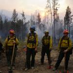 A Forest Service fire crew gets brief during an operation. Fire crews from Alaska are frequently deployed to the Lower 48 to help combat wildfires that are growing larger and closer to urban areas in many cases. (Courtesy photo / Parker Anders)
