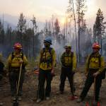Courtesy photo / Parker Anders
A Forest Service fire crew gets brief during an operation. Fire crews from Alaska are frequently deployed to the Lower 48 to help combat wildfires that are growing larger and closer to urban areas in many cases.
