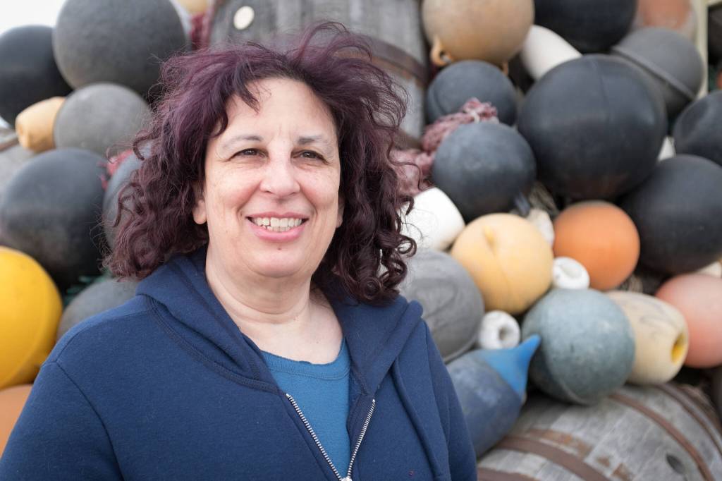 Screenwriter Karen Frank poses for a portrait outside of Bunnell Street Arts Center in Homer, Alaska. (Photo by Sean McDermott)