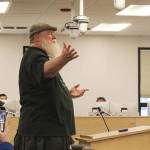 Larry Opperman sings the Green Acres theme song as part of a radiothon pledge during a meeting of the Kenai Peninsula Borough Assembly on Tuesday, April 19, 2022, in Soldotna, Alaska. (Ashlyn OHara/Peninsula Clarion)