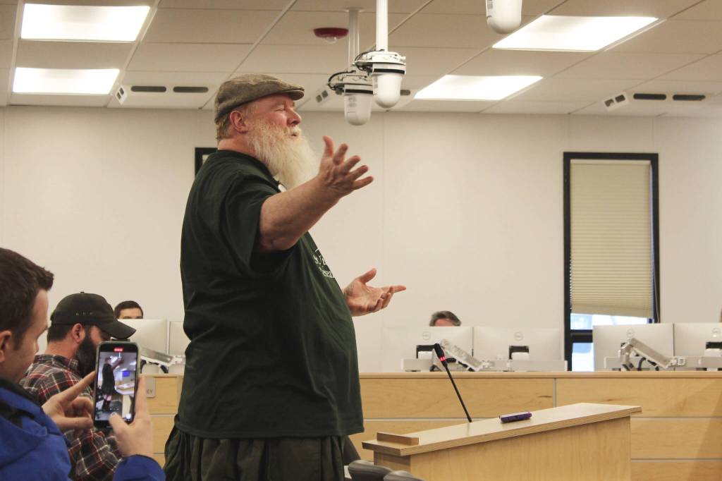 Larry Opperman sings the Green Acres theme song as part of a radiothon pledge during a meeting of the Kenai Peninsula Borough Assembly on Tuesday, April 19, 2022, in Soldotna, Alaska. (Ashlyn OHara/Peninsula Clarion)
