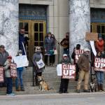 Protesters critical of the cruise ship industry gathered on the steps of the Alaska State Capitol on Monday, April 25, 2022, the same day the first large ship of the season arrived in Juneau. Demonstrators said the industry had a poor environmental record and called on the state to continue to Ocean Rangers program, a voter-approved initiative which put state monitors aboard ships to ensure compliance with state regulations. (Peter Segall / Juneau Empire)