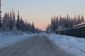 The sun sets on a backroad near Kalifornsky Beach Road on Dec. 21, 2021. New regulations allowing all-purpose vehicles on some roads go into effect Jan. 1, 2022. (Photo by Ashlyn OHara/Peninsula Clarion)