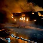 A trailer containing mail for the lower Kenai Peninsula burns on Tuesday, April 26, 2022, on the Seward Highway north of the Seward-Sterling Highway intersection, Alaska. (Photo provided, U.S. Postal Service)
