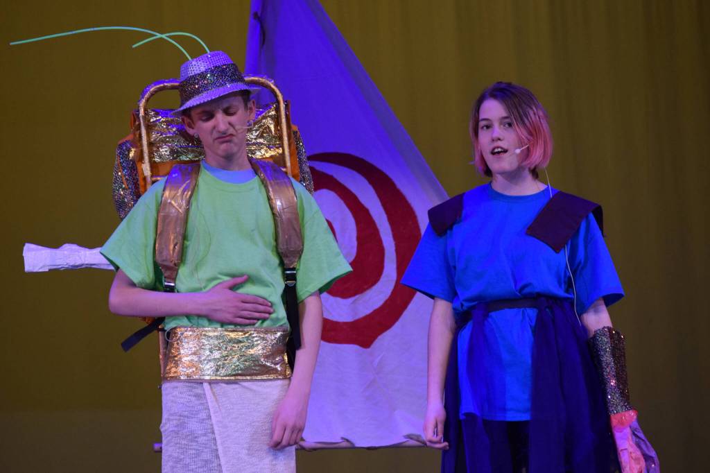 Alex Kahn and Madyson Davenport perform a scene from Moana during a dress rehearsal at the Renee C. Henderson Auditorium in Kenai, Alaska, on Wednesday, April 27, 2022. (Camille Botello/Peninsula Clarion)